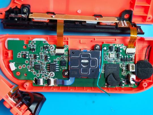 The PCB inside the red controller